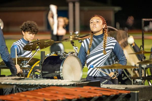 Summit High band members march